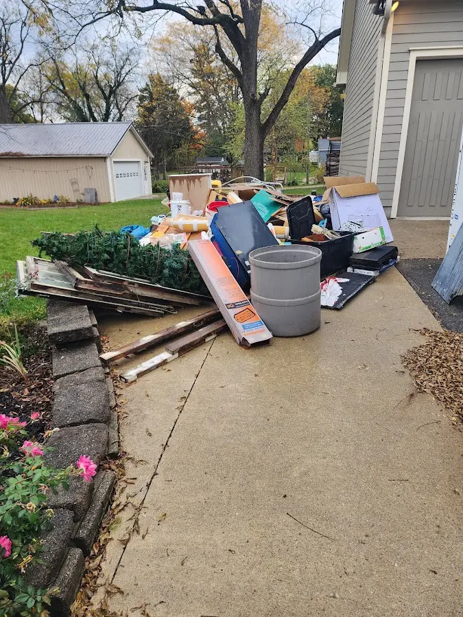 Dumpster being loaded with debris for Demolition Dumpster Rental in Ken Caryl